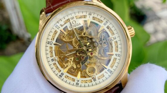 Đồng hồ nam Omega máy lộ cơ dây da nâu viền vàng