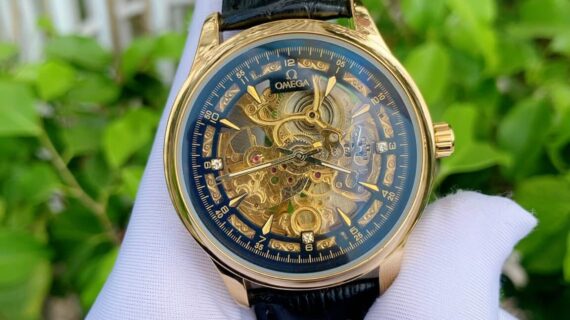 Đồng hồ nam Omega máy lộ cơ dây da đen viền vàng
